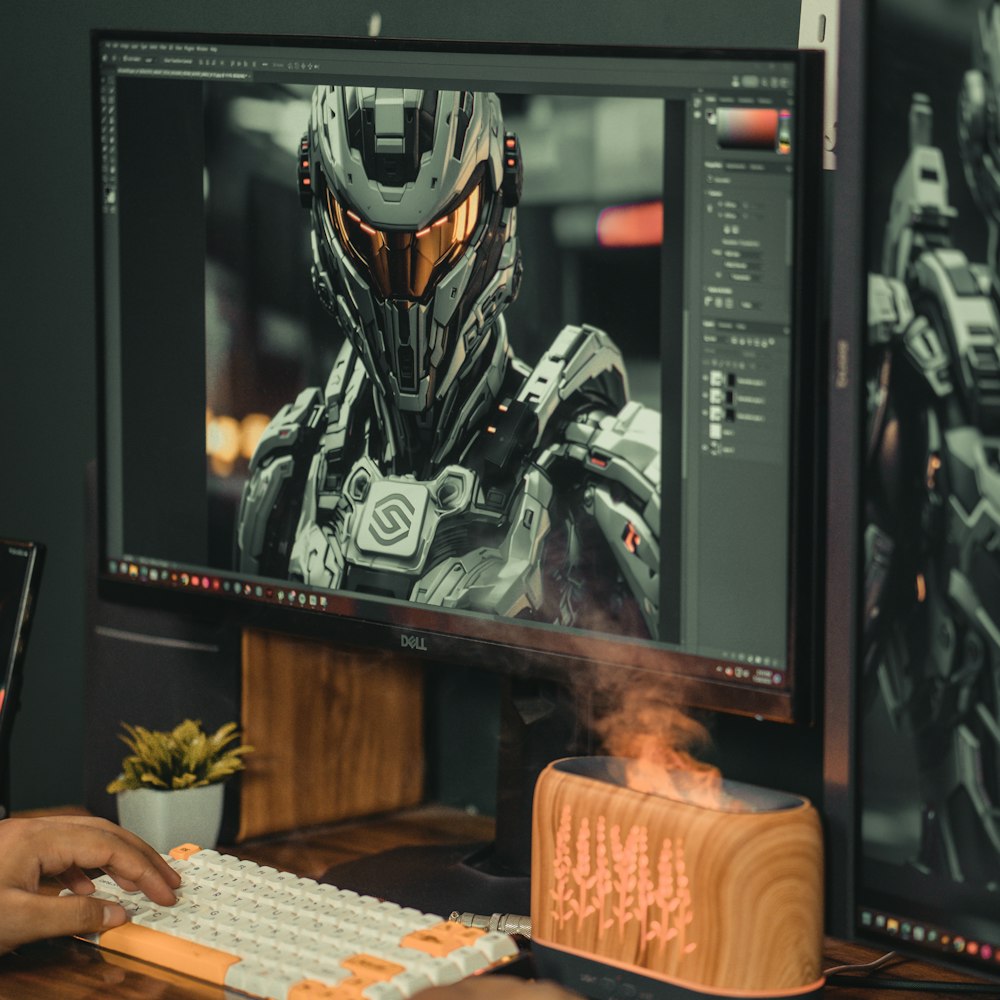 a person sitting at a desk in front of a computer