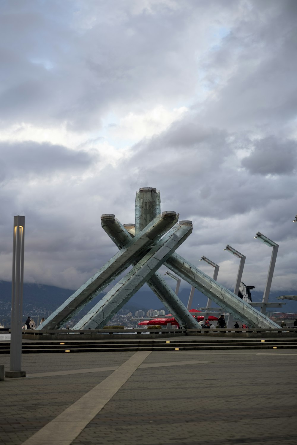 a large metal structure sitting on the side of a road