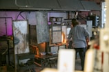 Artisan at work shaping glass panes in the Kings Lynn workshop