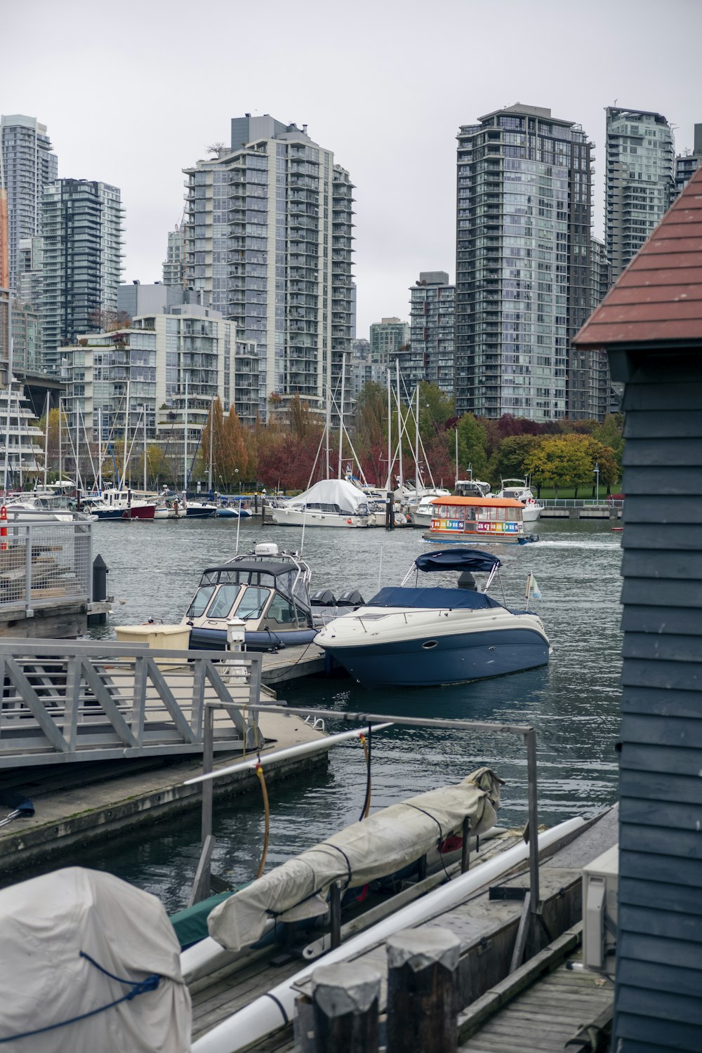 a boat is docked in a harbor with a city in the background