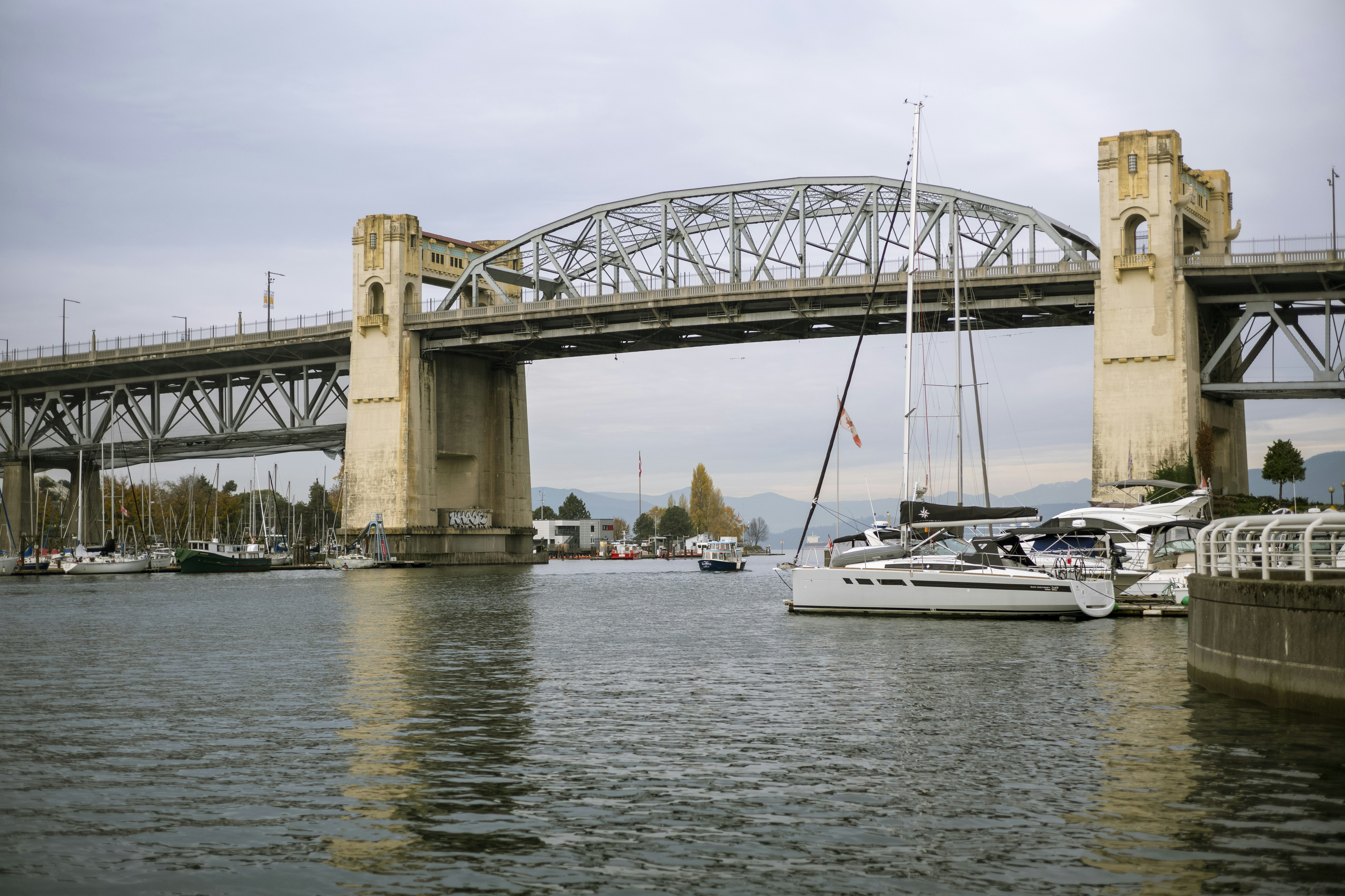 a bridge over a body of water with boats in it