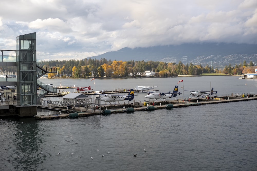 a dock with several planes parked on it