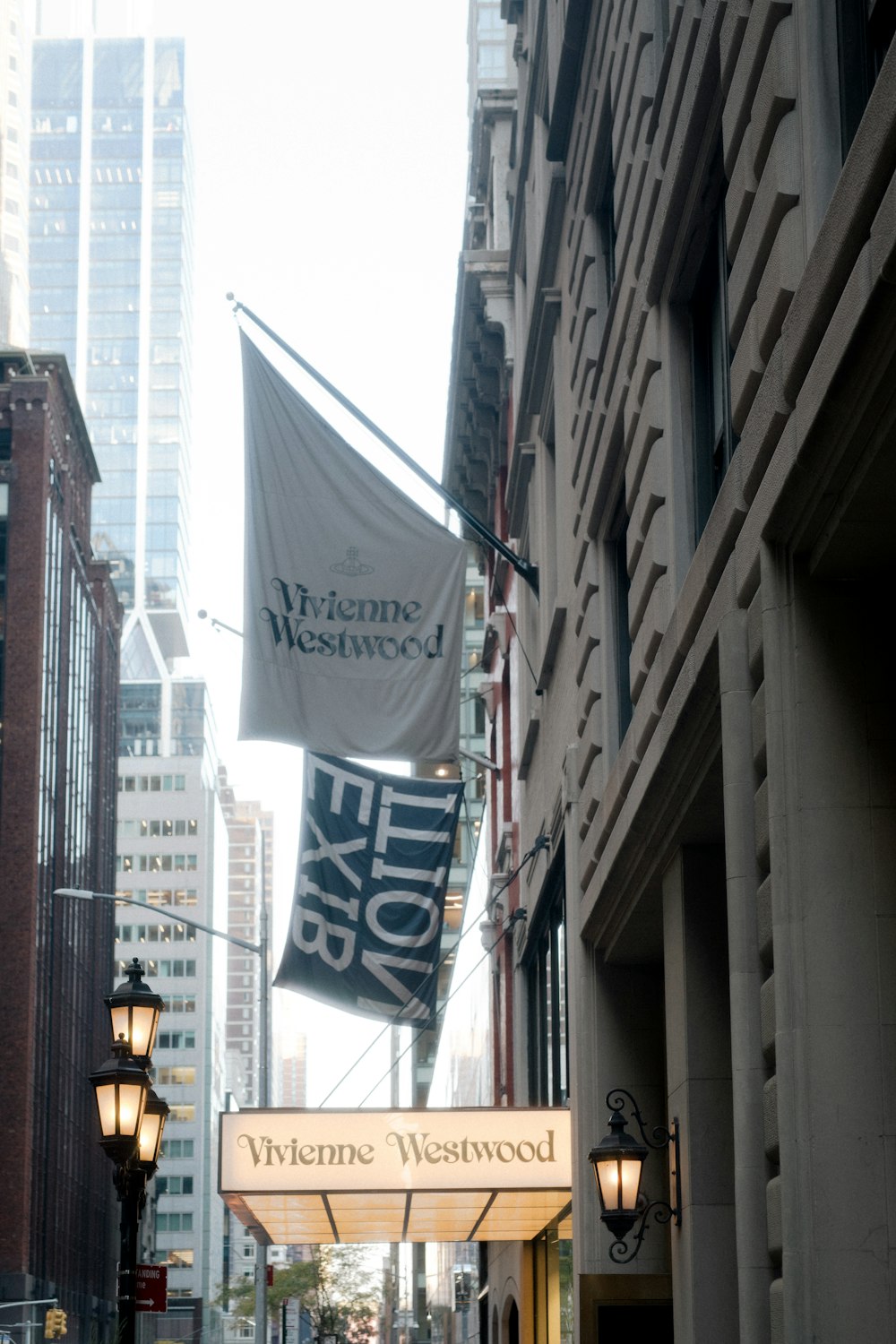 a city street with a sign that says welcome to the city