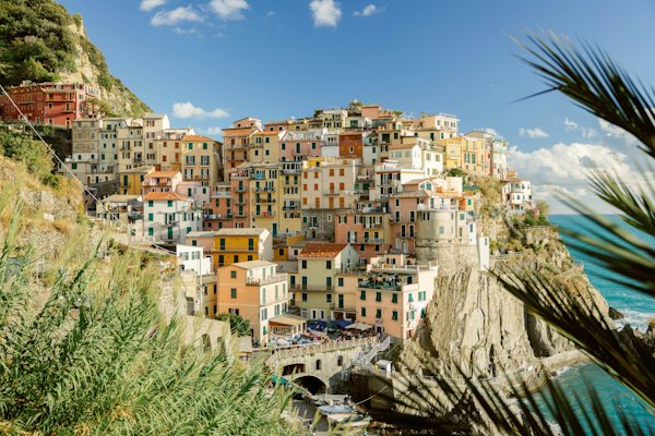A view of a village on a cliff overlooking the ocean — Cinque Terre, Italy