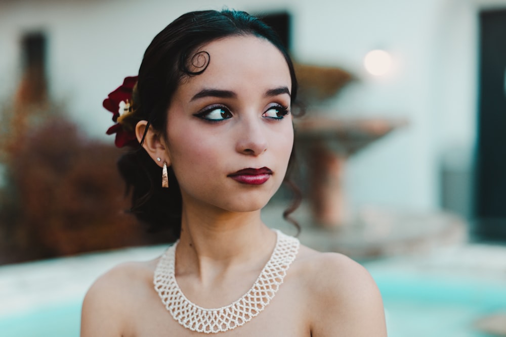 a woman with a flower in her hair