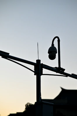 Cinematic shot of Makassar’s smart CCTV system monitoring public safety at dusk.