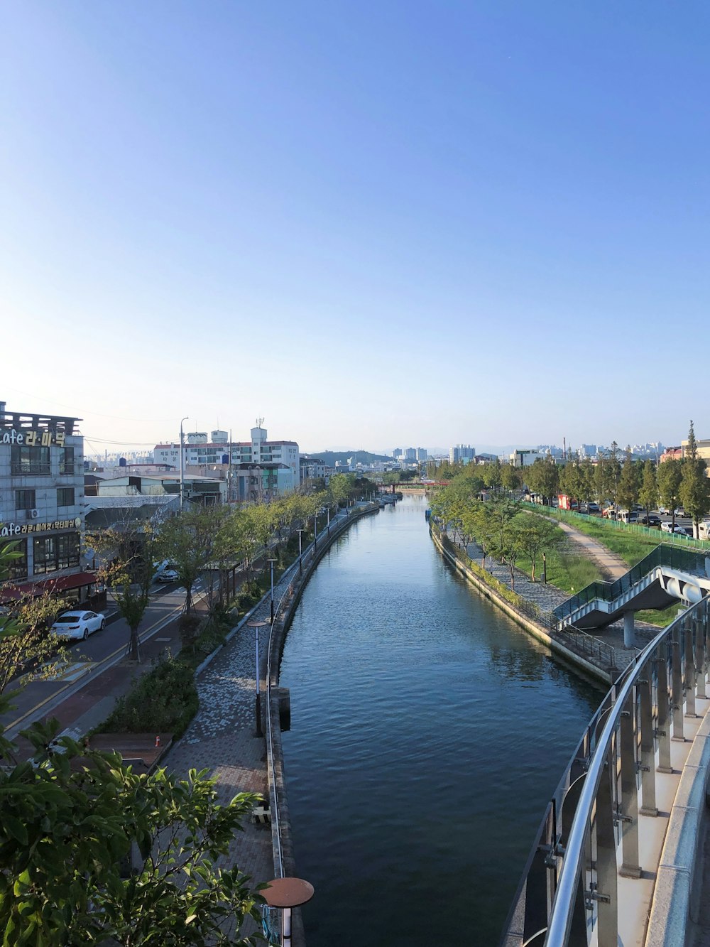 a river running through a city next to tall buildings