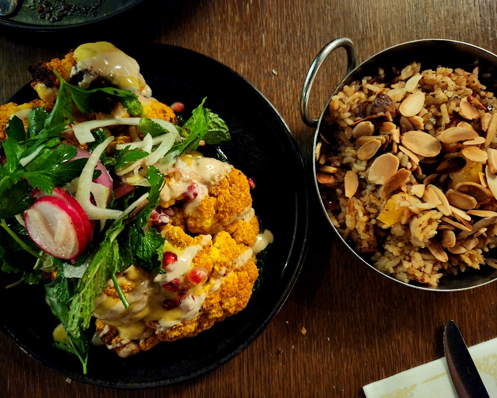 two plates of food on a wooden table