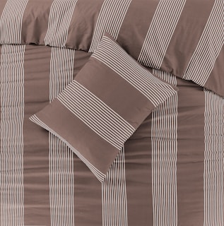 a bed with a brown and white striped comforter