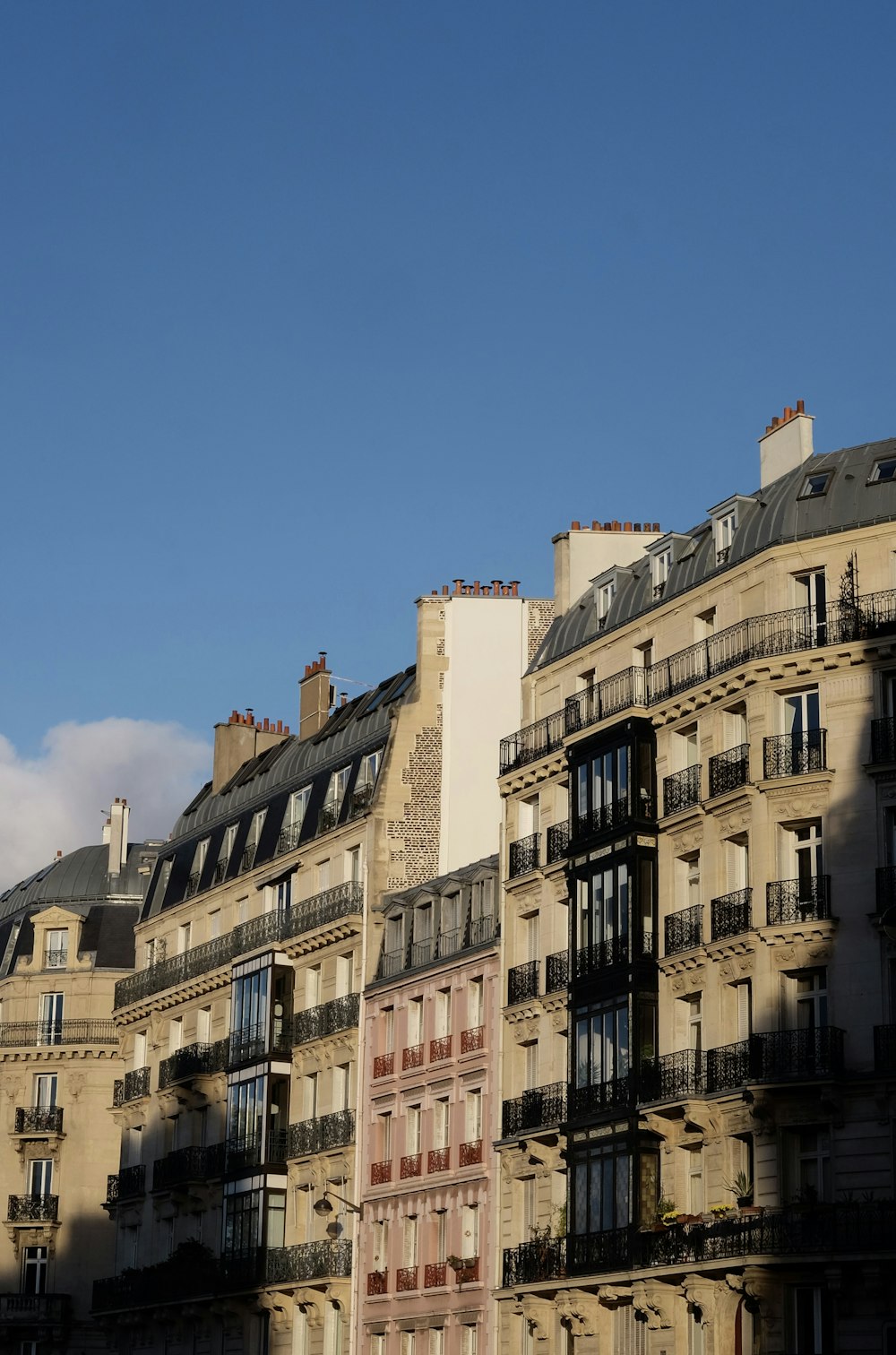 a row of buildings with balconies and balconies on top of them