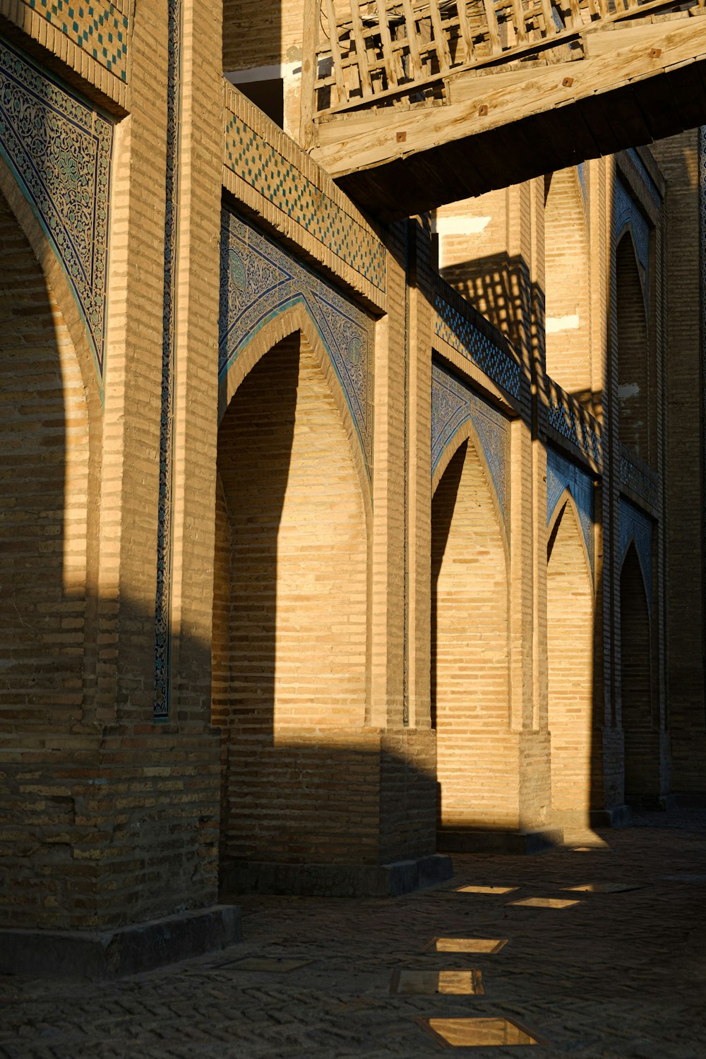 a person riding a skateboard under a bridge