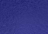 A digital artwork featuring a pattern of small, uniformly-shaped cubes arranged in a gradient, creating a sense of depth and perspective. The cubes are uniformly colored in shades of blue.