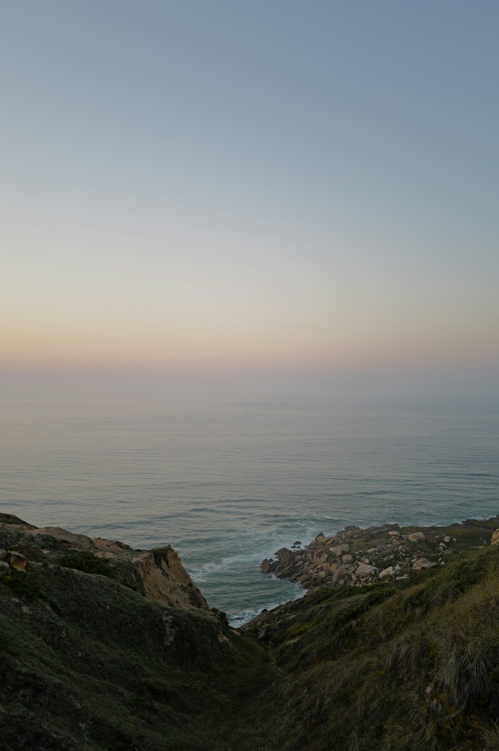 a view of a body of water from a hill