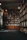Warm, inviting home library with floor-to-ceiling wooden bookshelves and cozy reading nook.