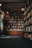 Warm, inviting home library with floor-to-ceiling wooden bookshelves and cozy reading nook.