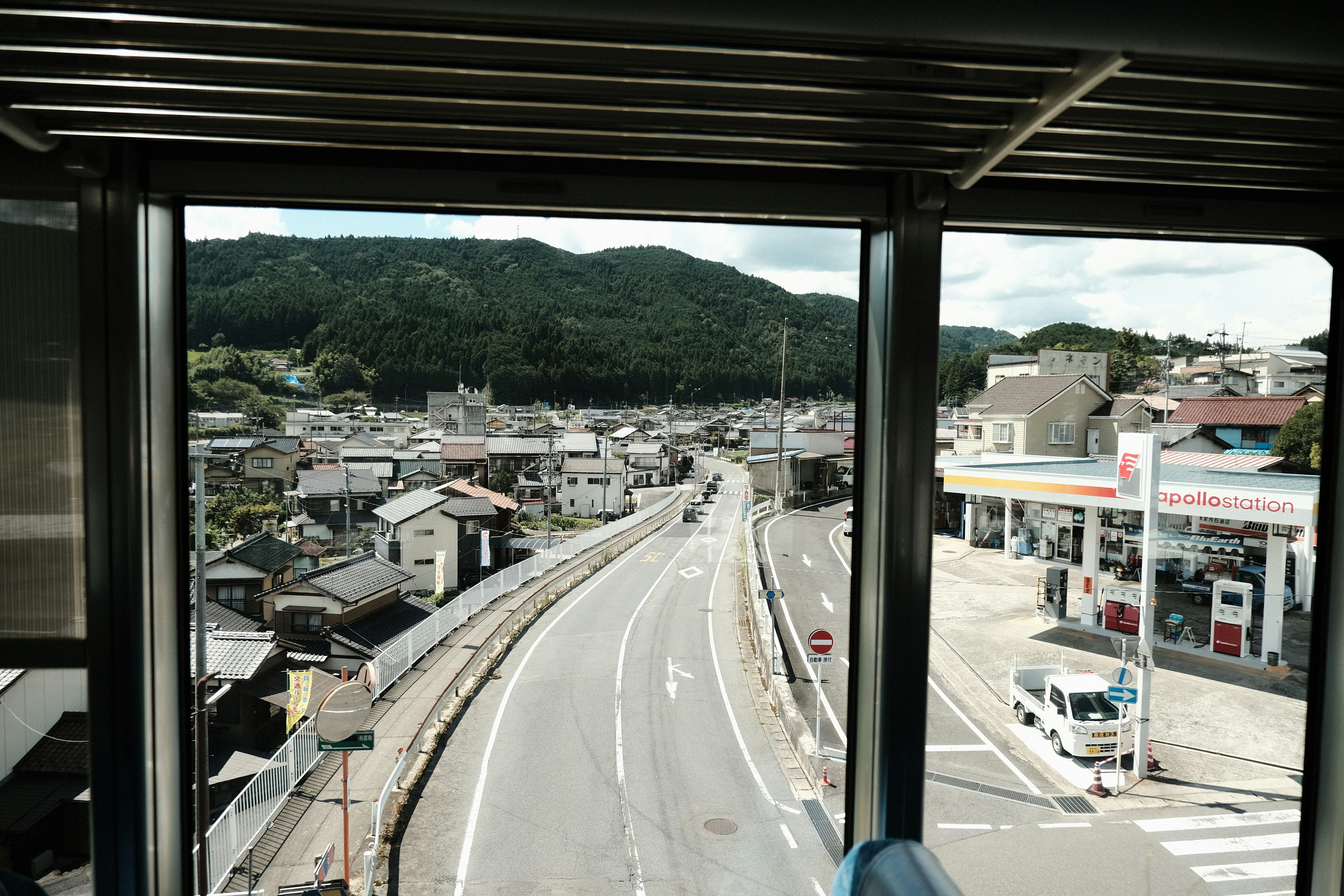 a view of a city from a bus window