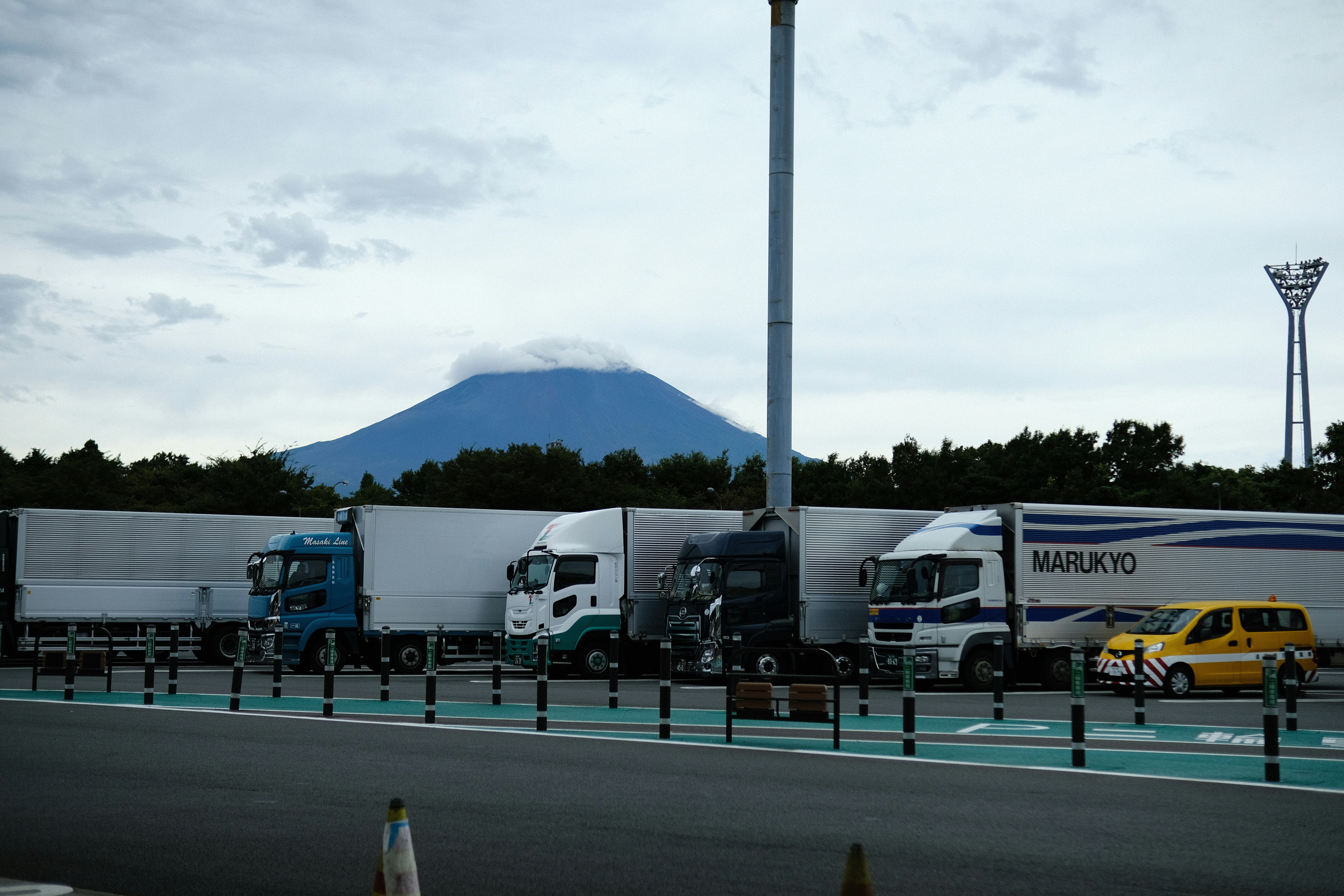 a-group-of-trucks-parked-next-to-each-other-photo-free-truck-image-on