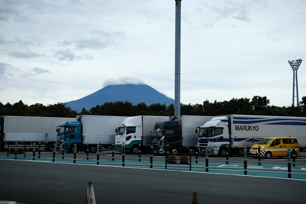 a group of trucks parked next to each other