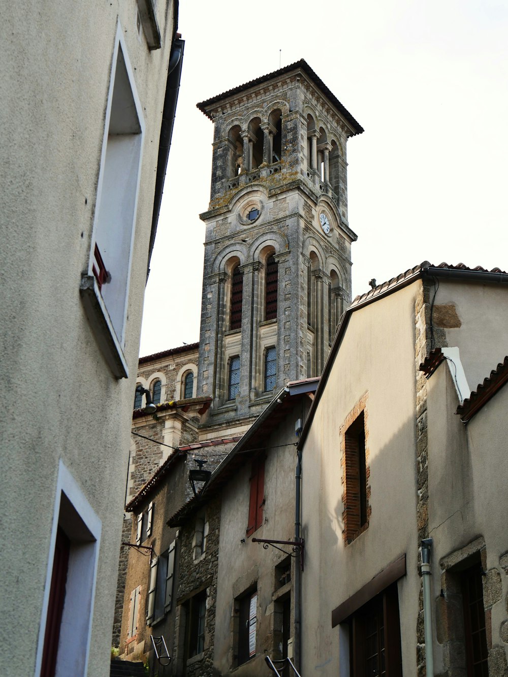 a tall tower with a clock on the top of it