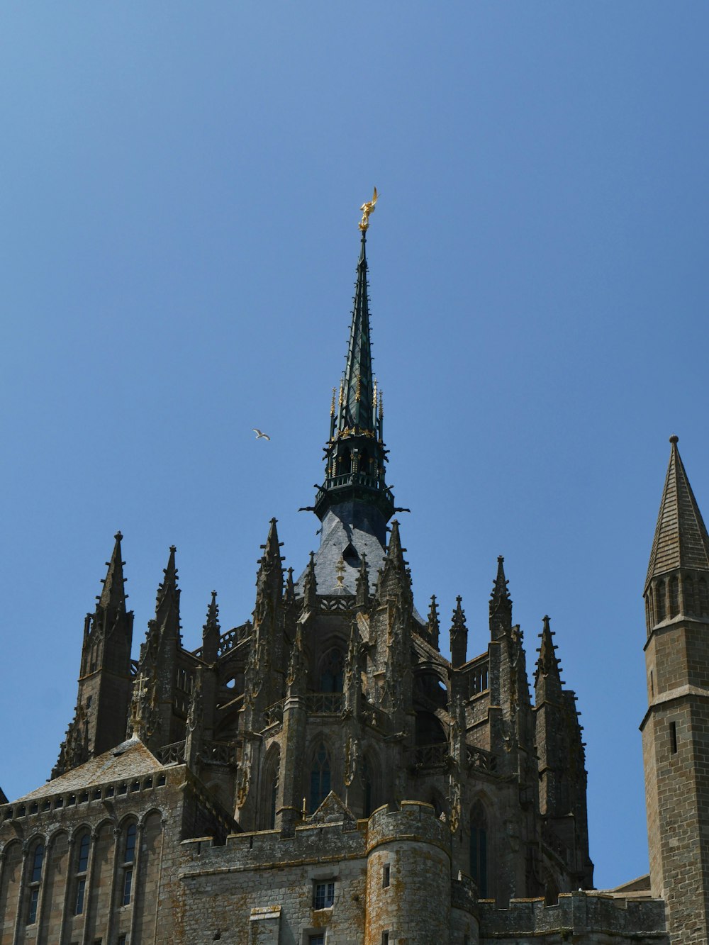 a very tall building with a clock on it's side