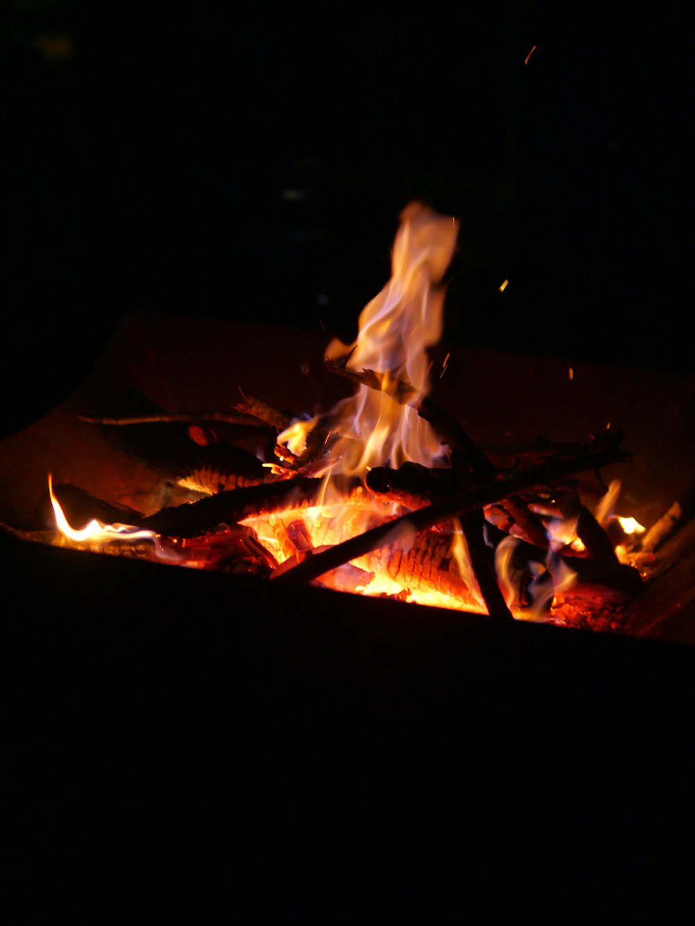 a close up of a fire in the dark