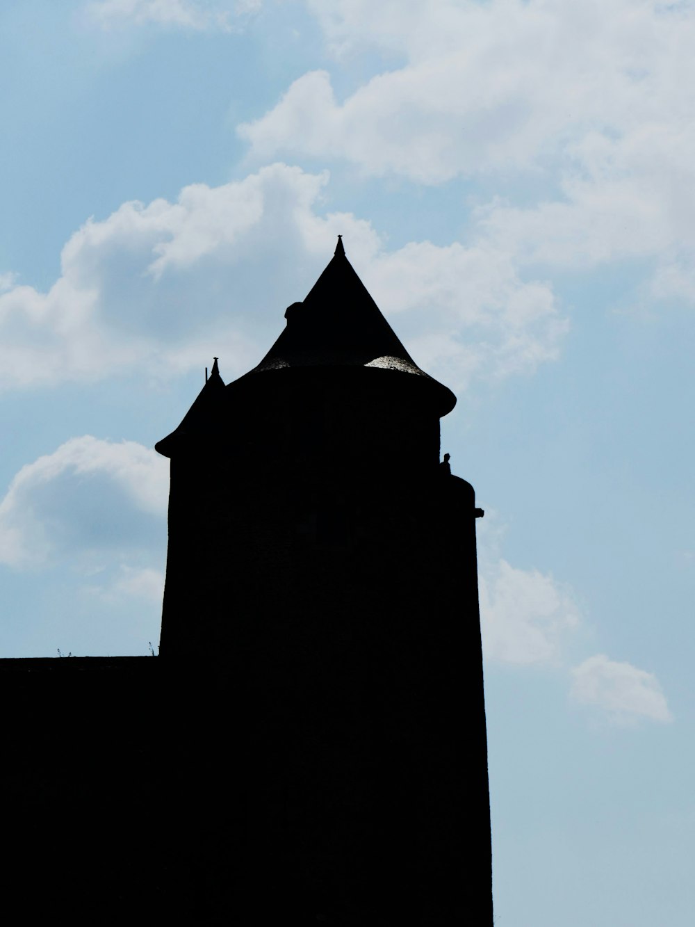 a tall tower with a clock on the top of it