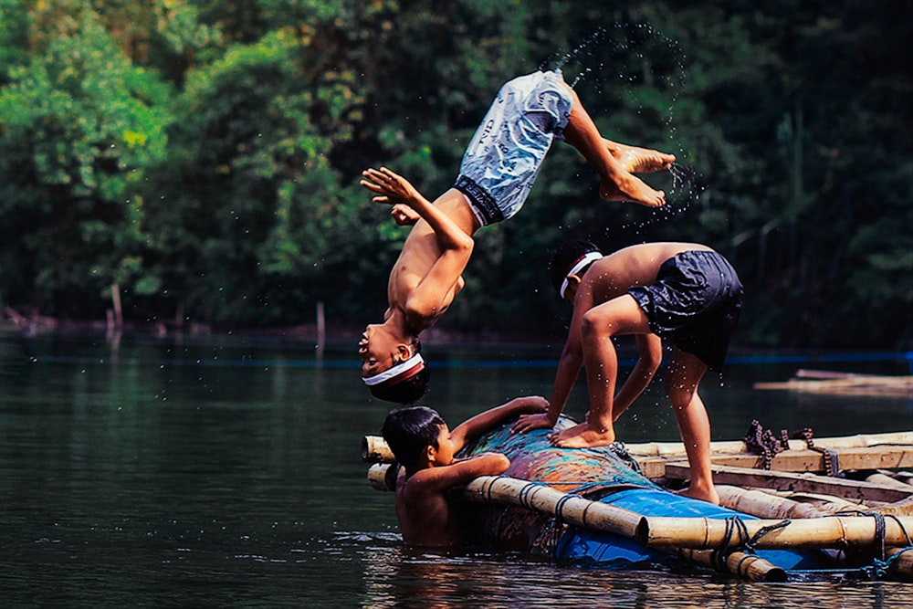 a couple of people that are on a raft in the water