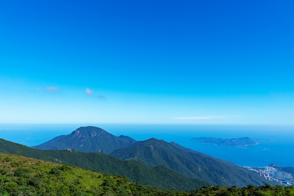 the view from the top of a mountain overlooking the ocean