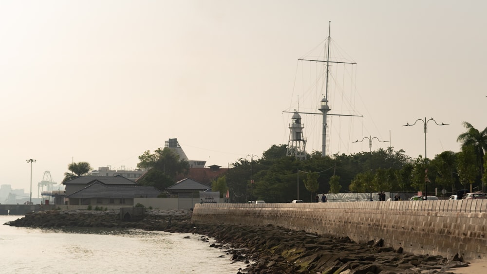 a boat is docked at the shore of a body of water