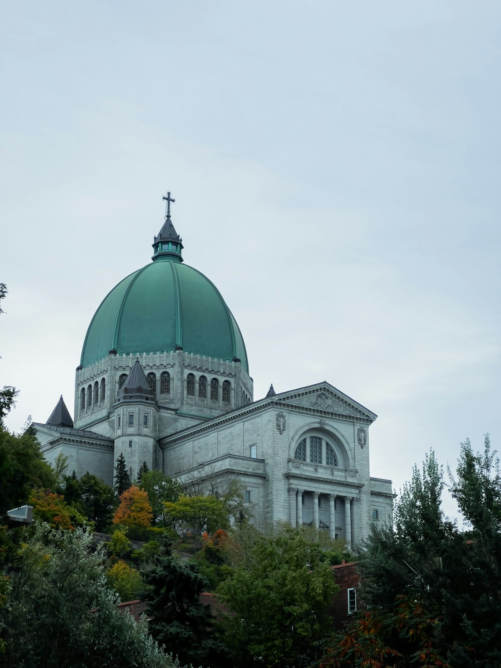 a large building with a green dome on top of it