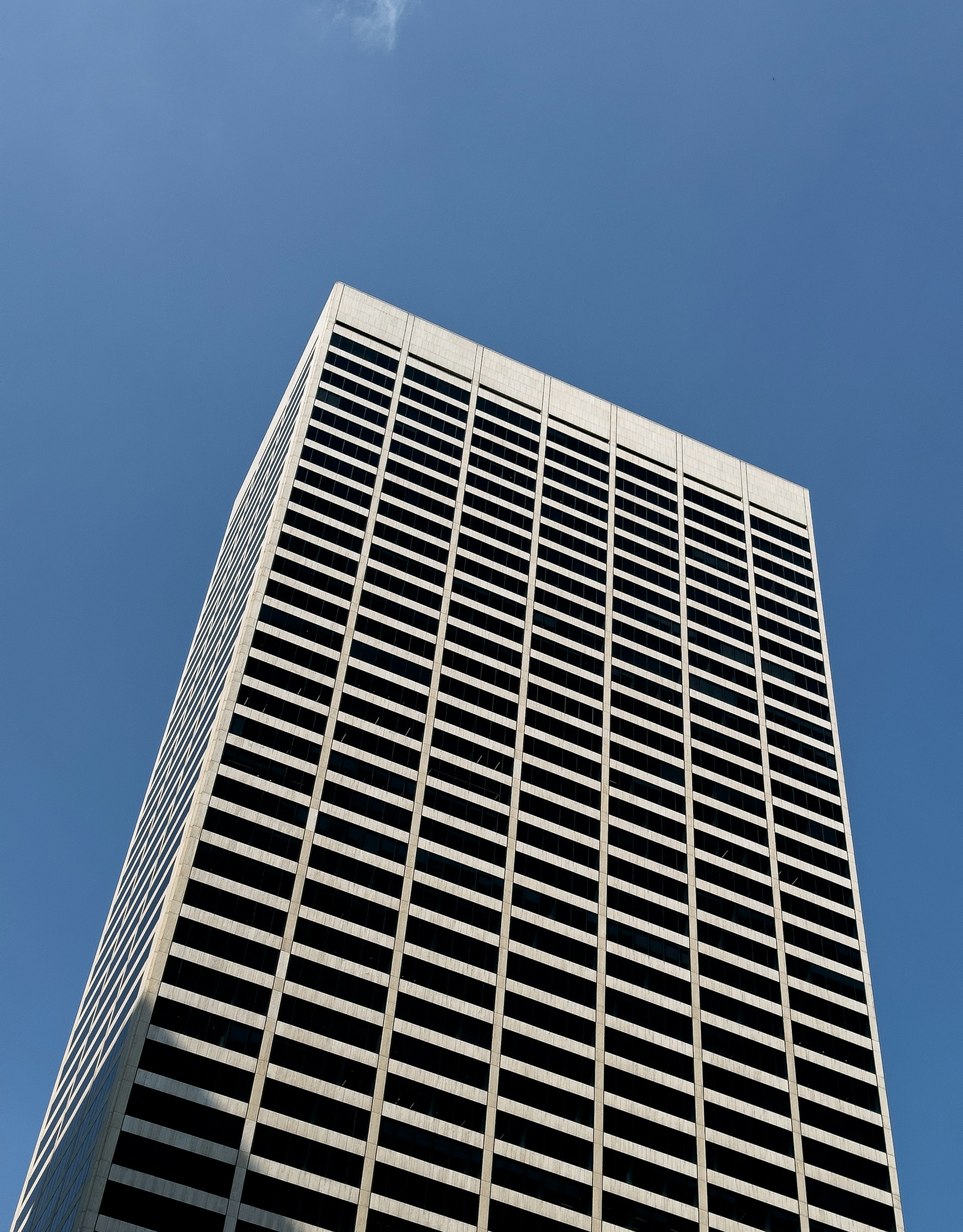 a very tall building with a sky in the background