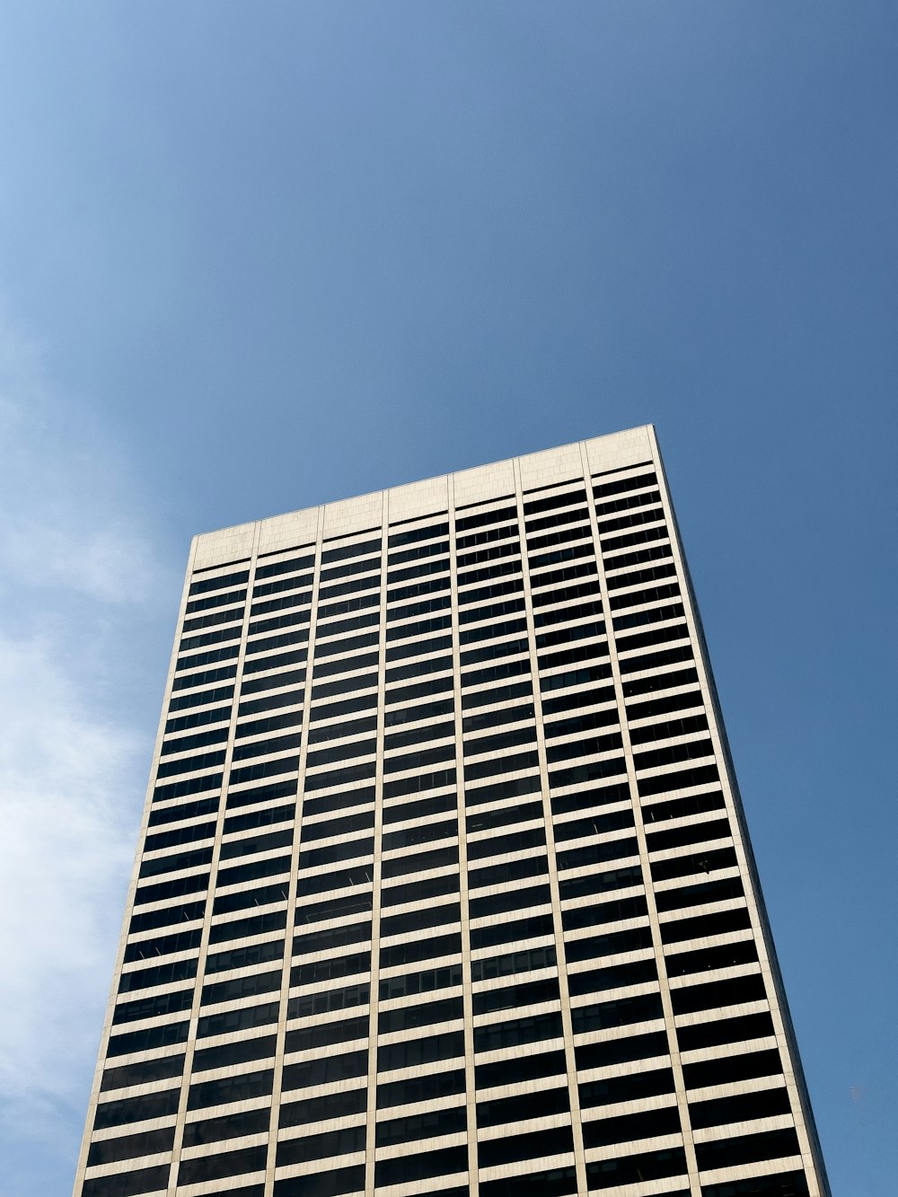 a very tall building with a sky in the background