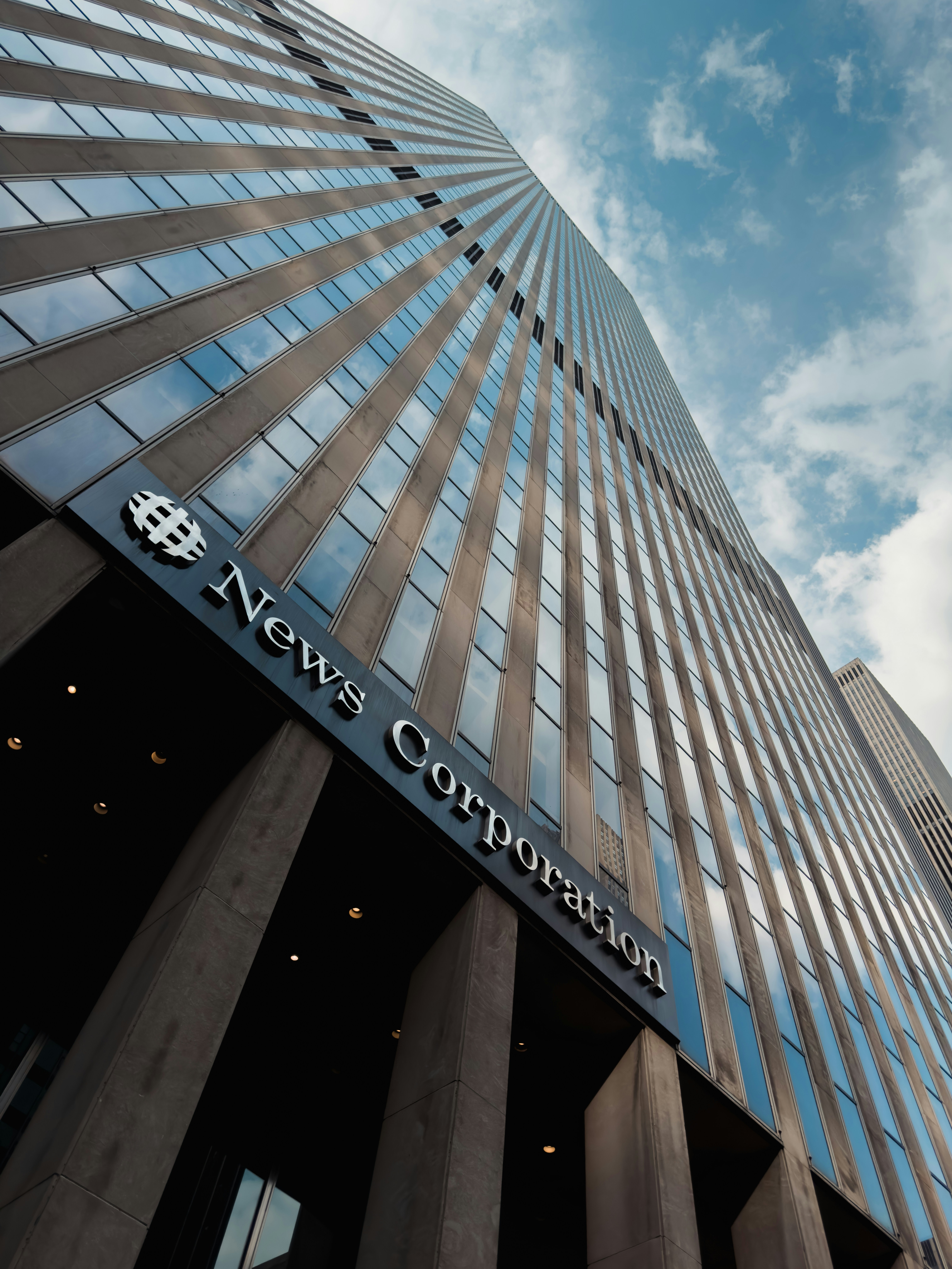 a very tall building with a sky background