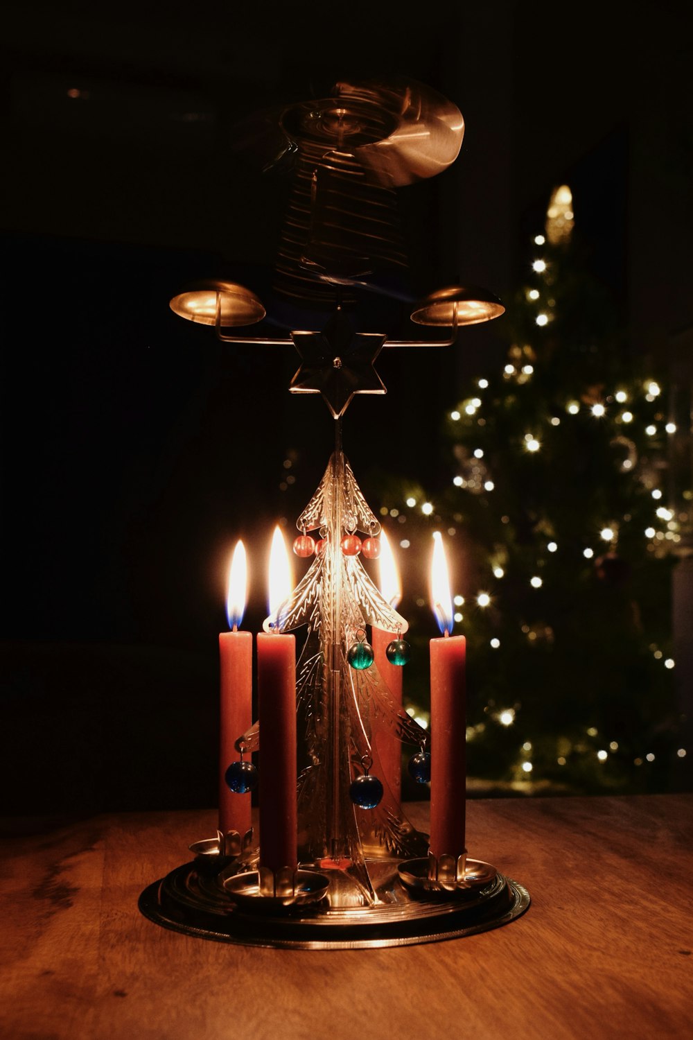 a group of candles sitting on top of a wooden table