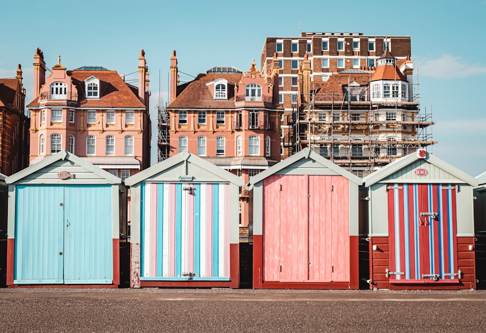 a row of beach huts sitting next to each other