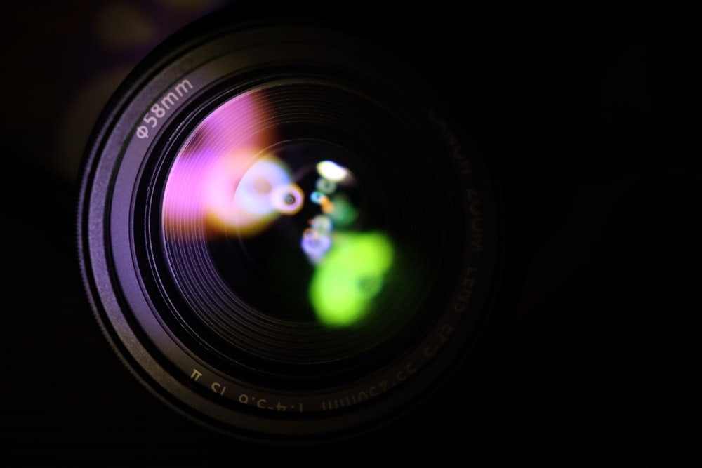 a camera lens with a blurry image of a flower