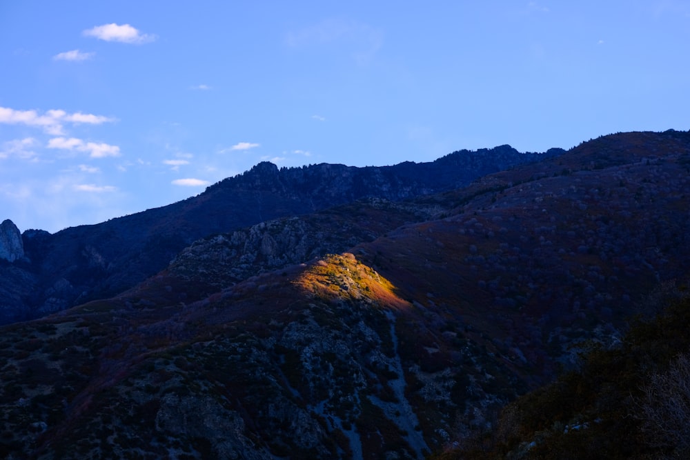 a view of a mountain with a bright light on it
