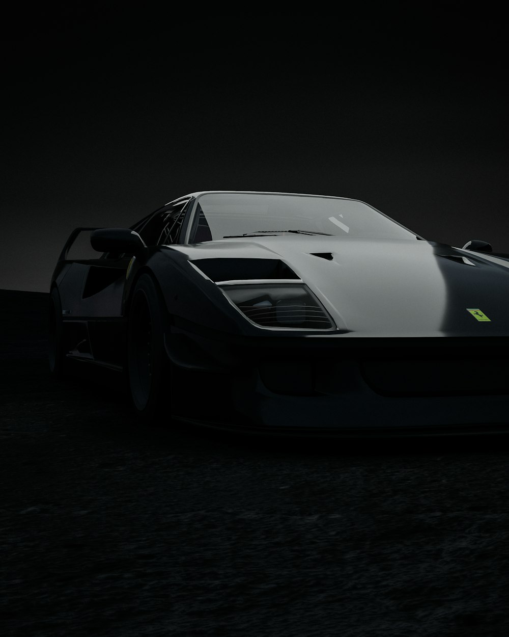 Une voiture de sport en noir et blanc dans l’obscurité