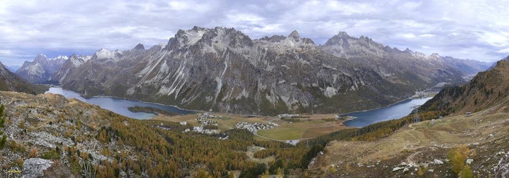 a view of a mountain range with a lake in the middle