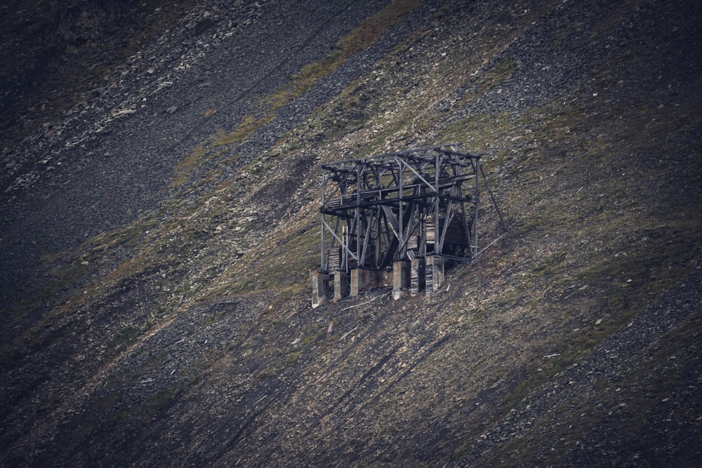 an aerial view of a train trestle on a hill