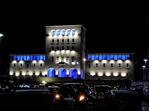 a building lit up with blue lights at night