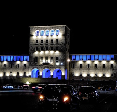 a building lit up with blue lights at night