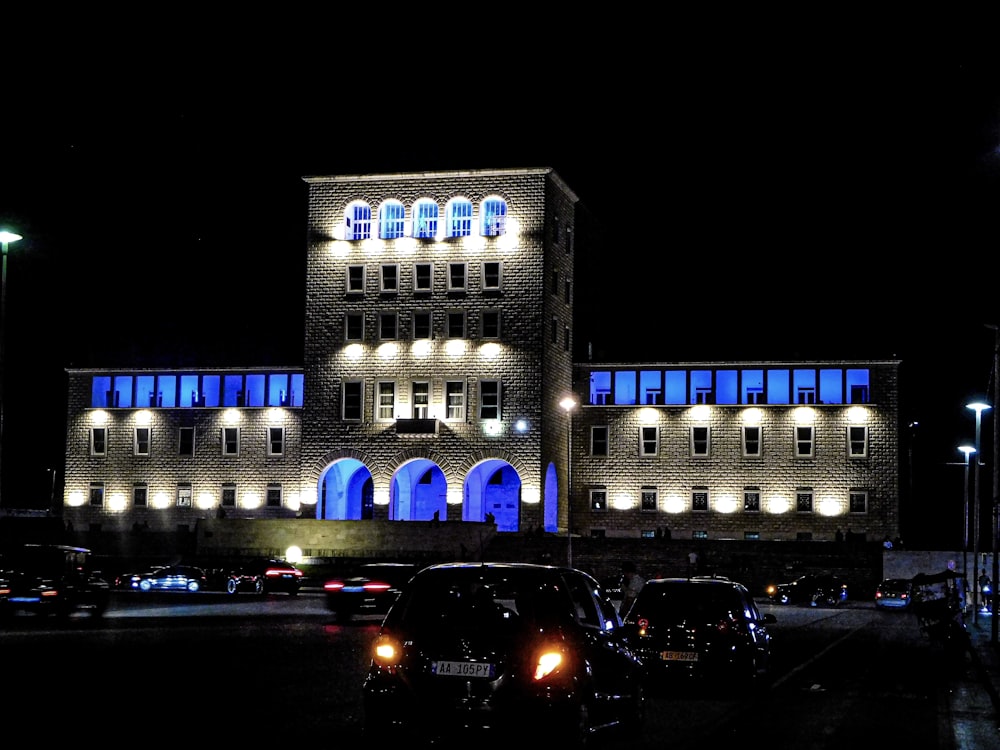 a building lit up with blue lights at night