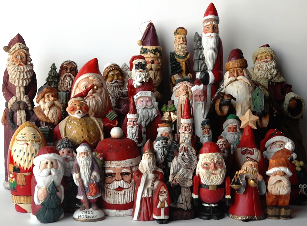 a group of santa claus figurines sitting next to each other