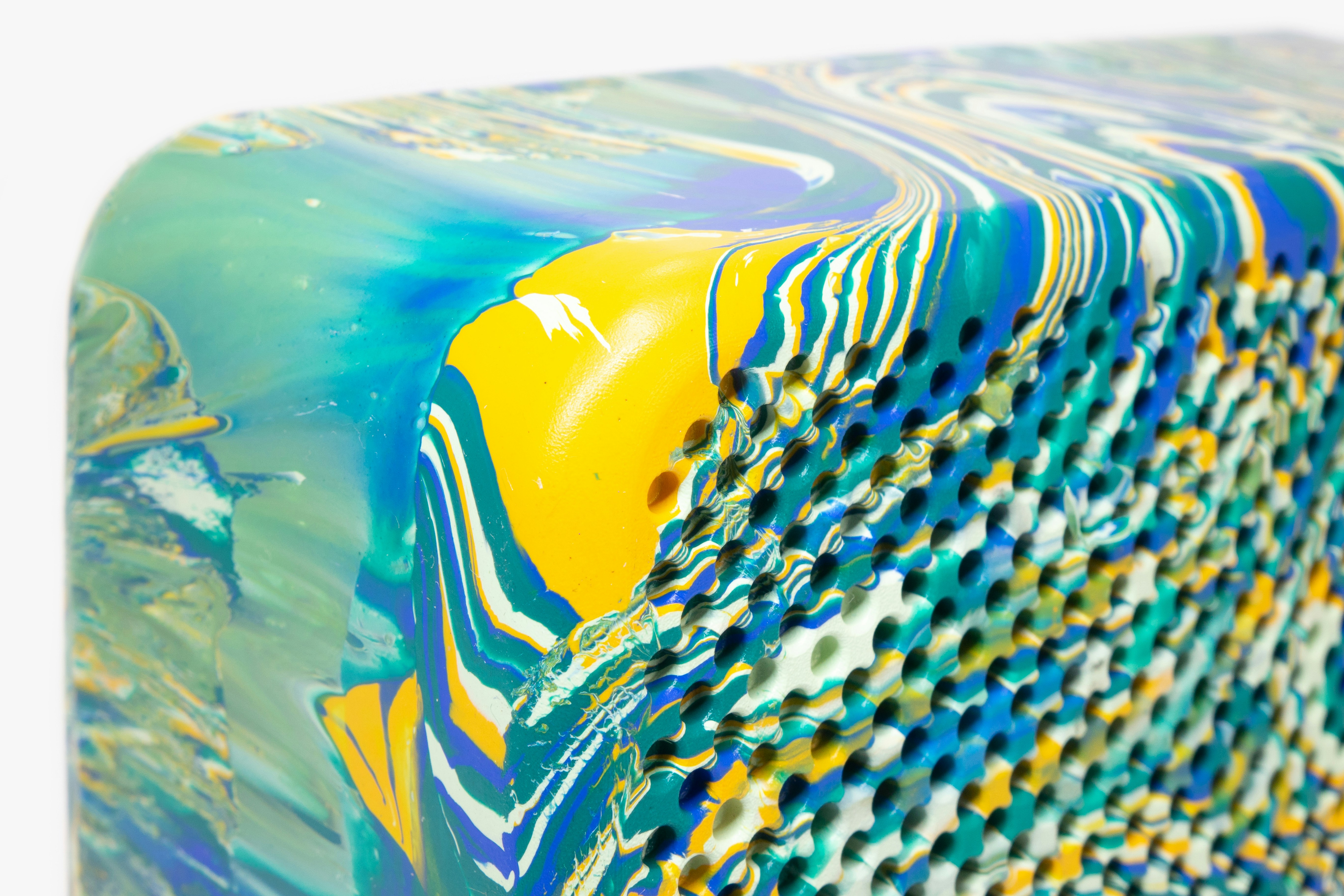 a close up of a blue and yellow object