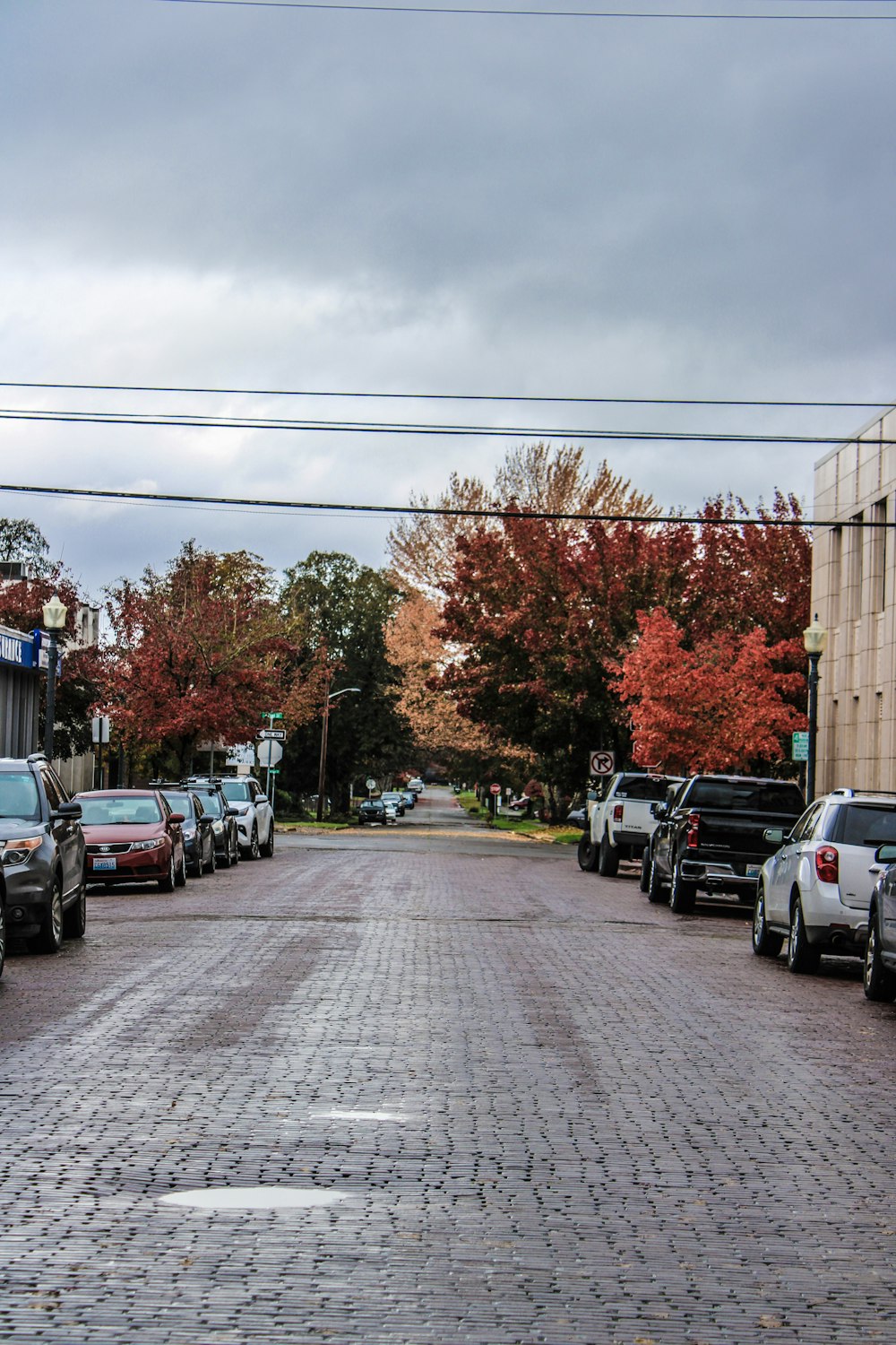 a street with cars parked on both sides of it