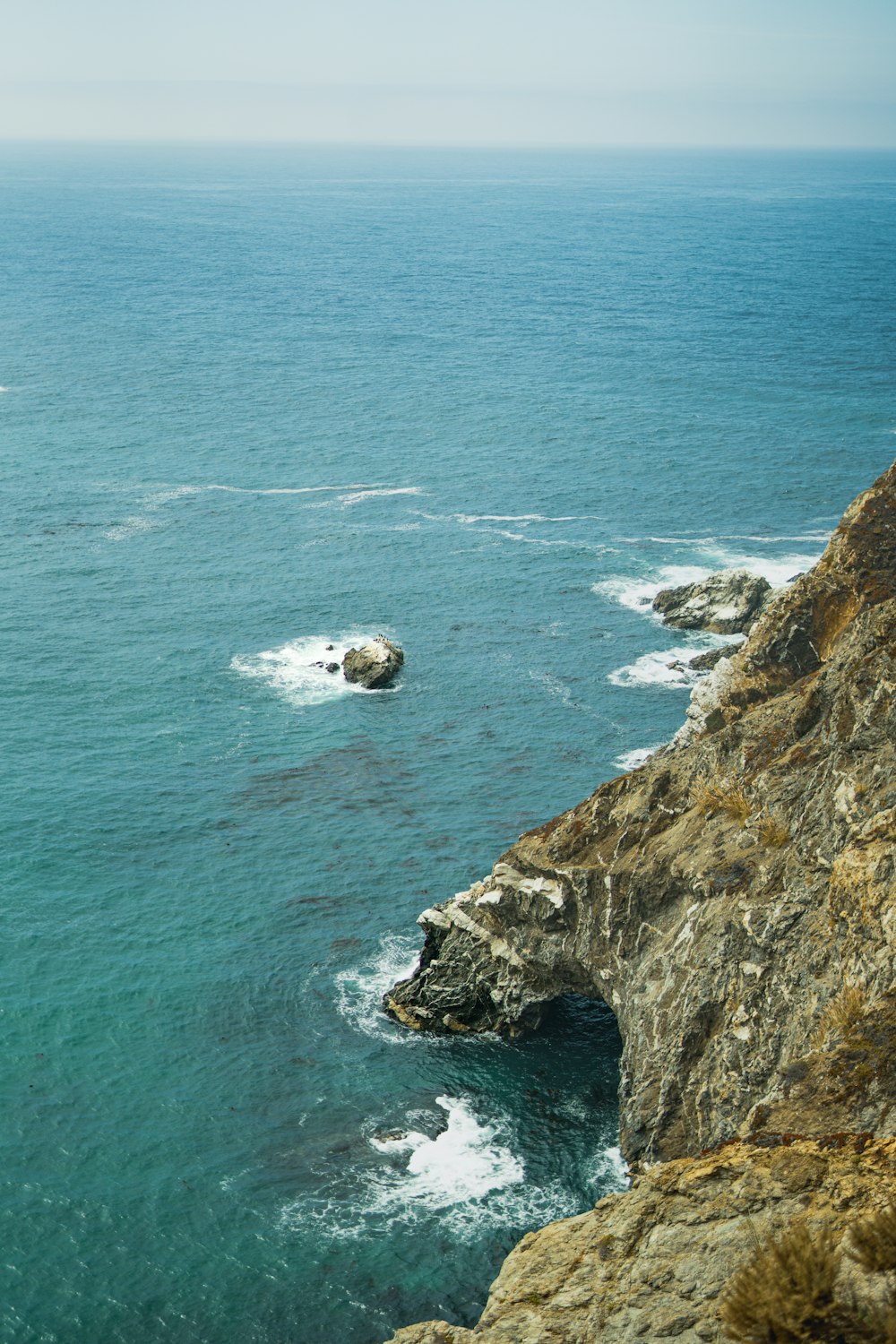 a view of the ocean from a cliff