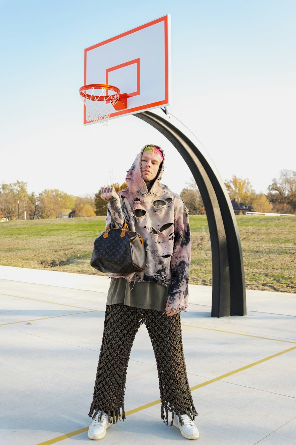 a woman standing in front of a basketball hoop