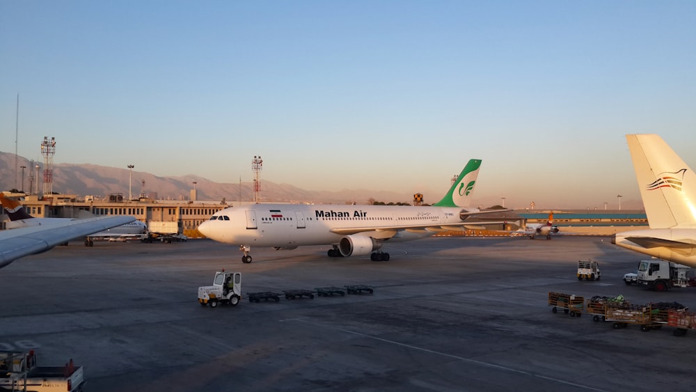 a large jetliner sitting on top of an airport tarmac