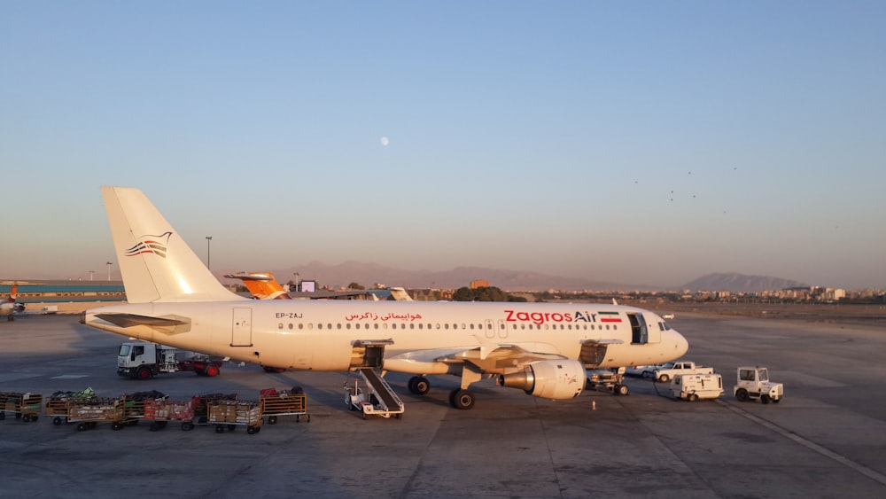 a large jetliner sitting on top of an airport tarmac